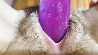 Anita Coxhard masturbates with a big purple double headed dildo