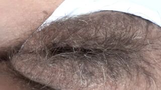 While I rest at the hotel on the beach, my boss films my big hairy pussy