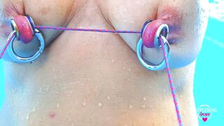 nippleringlover - horny milf does self nipple bondage in pool, pierced nipples bound with string pulled hard