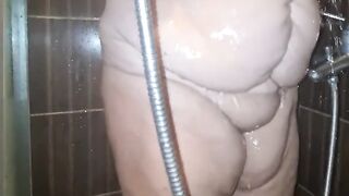 Fat Mature Granny Mom is getting fully naked. She takes a shower and the fat body is a big boner.