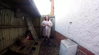 sexy wife Haley outdoors in plastic mac and Wellingtons