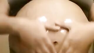 Pregnant ebony belly rub