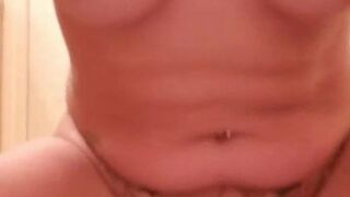 Tattooed MILF squirts while riding dildo