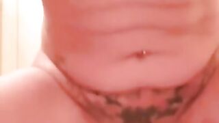 Tattooed MILF squirts while riding dildo